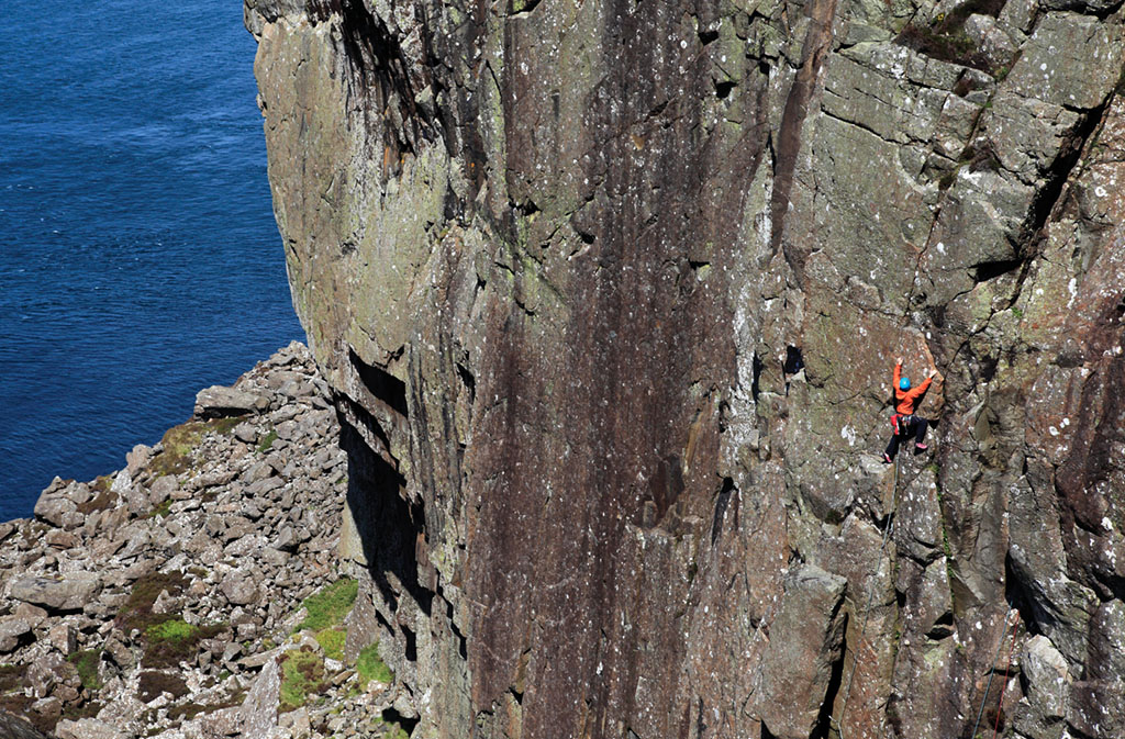 A climber enjoying the evening sun on the classic easier line of Girona (VS 4c) at Ballycastle Descent Gully East. Photo: Mike Hutton